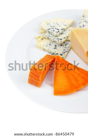 fresh aged french cheese parmesan roquefort and gruyere chops with slices on plate with isolated over white background