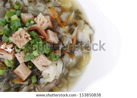 diet food : vegetable soup with bread  crackers in white bowl isolated over white background