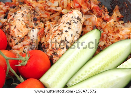 meat grilled chicken fillet cooked with vegetables on ceramic pan isolated over white background