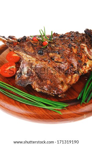 grilled ribs with vegetables on white background