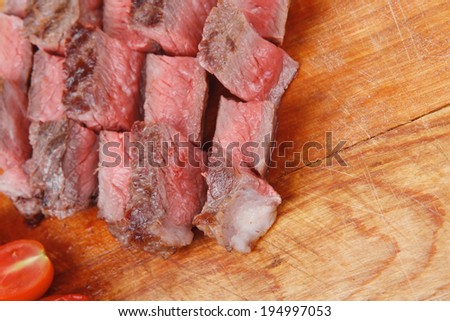 meat food : roast beef steak on wood plate isolate on white background