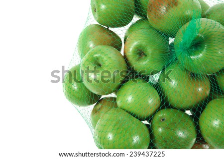 fresh green apples in green transport net ready to sell isolated on white background