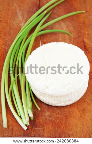 diet products : salted greek feta white cheese on wood isolated over white background