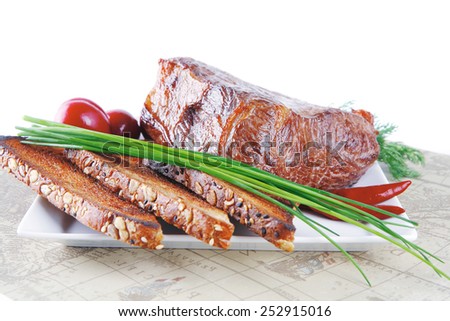 grilled meat served with vegetables and bread