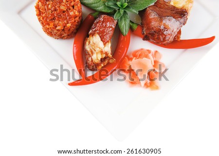 meat main course served on white plate over white