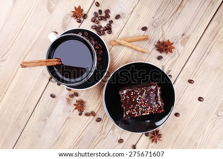 sweet food : black fragrant coffee and chocolate cake with cinnamon , coffee beans, and anise star