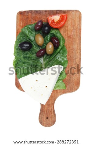 gogonzola mold cheese on wooden platter with olives and tomato isolated over white background