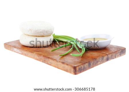 dairy products : feta white cheese on cut board isolated over white background