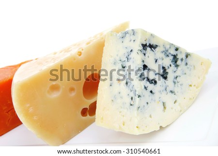 aged parmesan roquefort and gruyere chops delicatessen cheeses on white plate isolated over white background