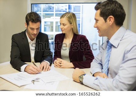 Couple signing real-estate contract