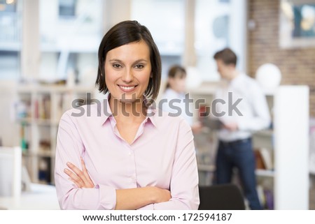 Portrait of smiling Businesswoman in startup , looking camera