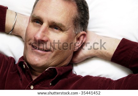 man lying down on pillow