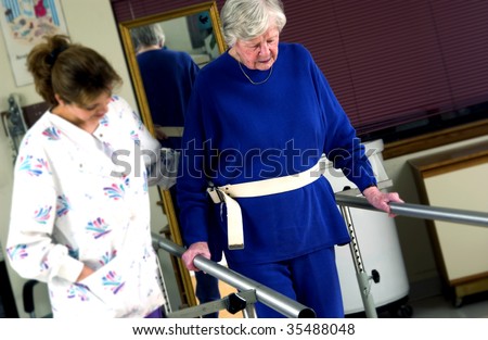 nurse helping senior woman with physical rehabilitation