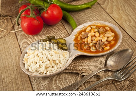 Hot turkish bean stew with a tasty tomato sauce and rice turkish pilav