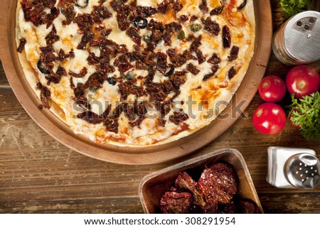 Italian super delicious mixed Dried tomatoes and olive pizza