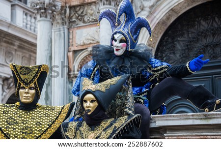 VENICE - FEB 13, 2015: An unidentified masked person in costume in St. Mark\'s Square during the Carnival of Venice on February 13, 2015. The 2015 carnival was held from February 7 Th to February 17Th