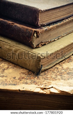 Old antique  books with worn binding and small spots of time