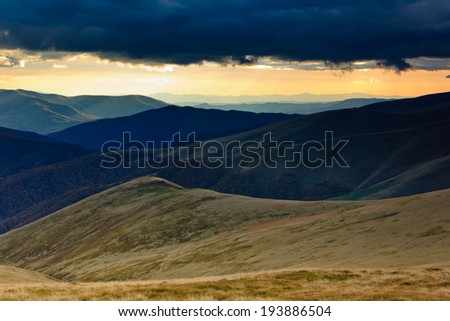 Mountain landscape valleys at dramatic sunset