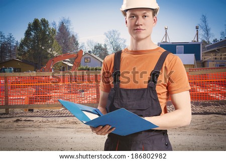 Construction worker takes notes from client