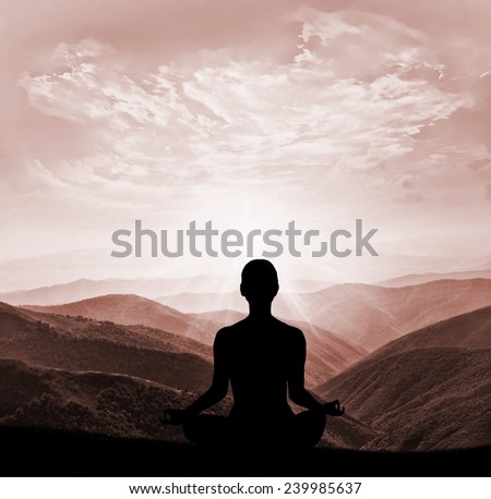 Yoga silhouette in the mountain