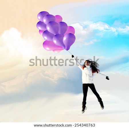 Happy girl fly with balloons