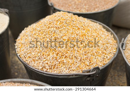corn grits  in a bucket close-up