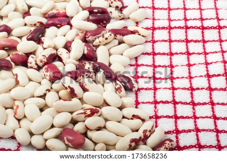 red and white beans on kitchen towel