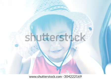 Soft focus boy wearing a hat With Filters blue light