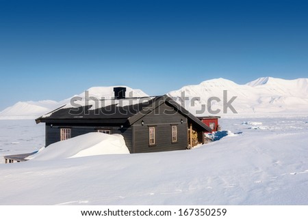 House in wintry Landscape, Arctic North Pole, Svalbard.