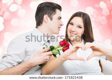 Man giving red rose to a woman, she make hearth by hands.White background
