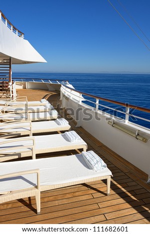 row of beds on the ship deck