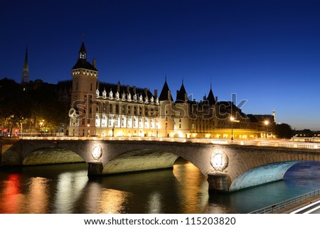 The Pont au Change, bridge over river Seine and the Conciergerieis, a former royal palace and prison in Paris, France.
