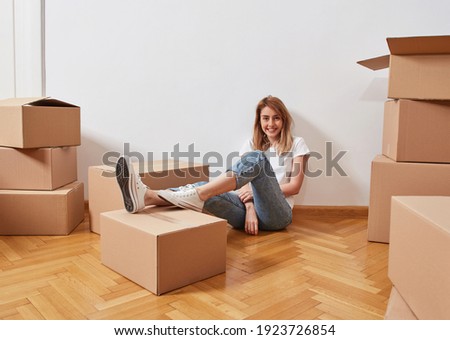 Similar – Image, Stock Photo Young female moving in new apartment