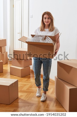 Image, Stock Photo Young female moving in new apartment