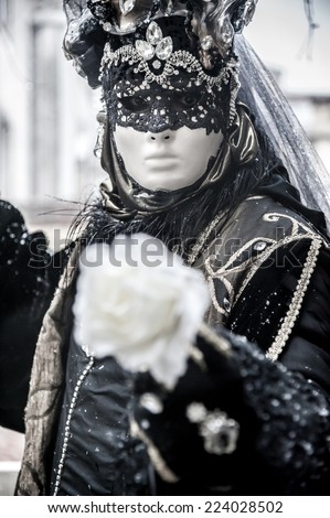 beautiful and mysterious portrait of a mask during venice carnival - italy