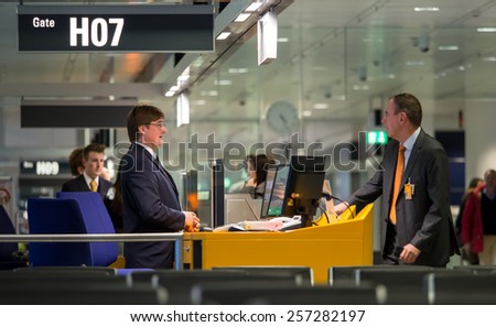 Munich, circa dec 2014: lufthansa service personnel at the gate ready to open the passenger boarding in Munich international airport.