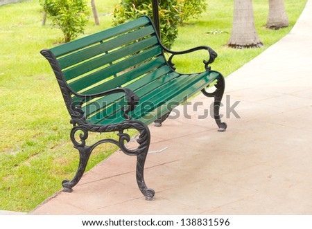 Stock Photo - metal garden chair in beautiful garden