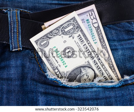 close-up of the United States dollar (US Dollars) in the pocket of jeans