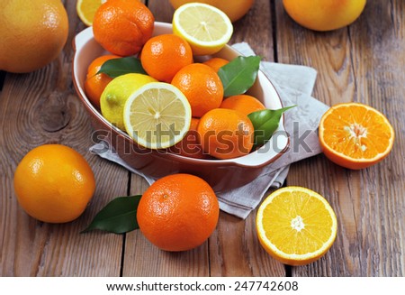 Beauty and health, food and drink, diet and nutrition concept. Citrus fruits (orange, lemon, tangerine, grapefruit) on a wooden table. Selective focus