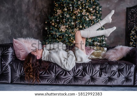 Similar – Image, Stock Photo Elegant woman sitting against brick wall