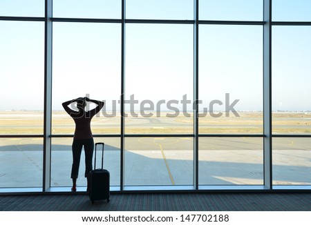 Girl at the airport window