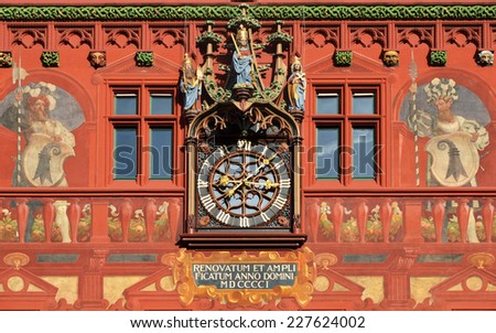 Clock on the wall of the city hall in Basel, Switzerland