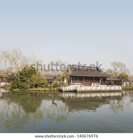 Ancient pavilion at dusk in early spring, located at Slender West Lake. The lake is a well-known scenic spot in the city of Yangzhou in Jiangsu province, China.