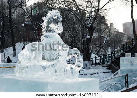 HARBIN, CHINA - DECEMBER 27, 2013: Horse. Ice sculptures of Harbin Ice-Lantern Show. December 27, 2013 in Harbin City, Heilongjiang Province, China.