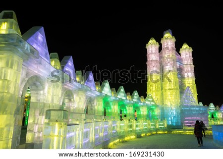 HARBIN, CHINA - DECEMBER 30, 2013: Ice building in Harbin Ice and Snow World. December 30, 2013 in Harbin City, Heilongjiang Province, China.