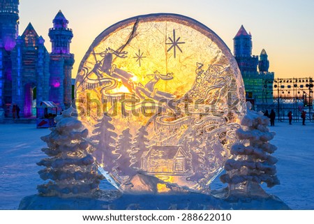 Harbin, China - January 6, 2015: Ice building at dusk. Harbin Ice and Snow World. People are visiting. Located in Harbin City, Heilongjiang Province, China.