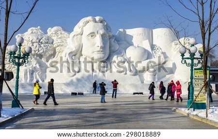 Harbin, China - January 11, 2015: Newton snow sculpture. People are walking. 27th China Harbin Sun Island International Snow Sculpture Art Expo. Located in Harbin City, Heilongjiang Province, China.