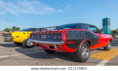 ROYAL OAK, MI/USA - AUGUST 15, 2014: Dodge Challenger and Plymouth \'Cuda (Barracuda) cars at the Woodward Dream Cruise, the world\'s largest one-day automotive event and a National Scenic Byway.