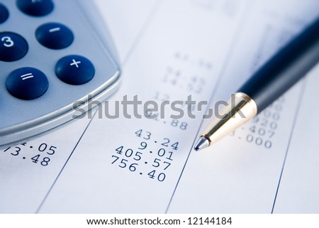 A calculator, pen, and financial statement.