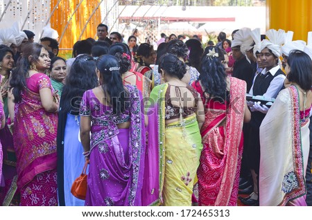 Mumbai, India - January 2014 - people dressing traditional Indian dresses  gathering at local wedding ceremony